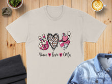 Load image into Gallery viewer, Peace love CMA graphic on tan t-shirt with stethoscope, syringe, heart, and leopard print peace sign.

