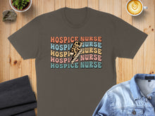 Load image into Gallery viewer, Brown t-shirt with colorful "HOSPICE NURSE" text and lightning bolt graphic.
