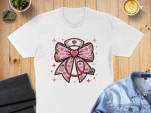 Load image into Gallery viewer, Pink nurse's bow with stethoscope and XOXO pattern.
