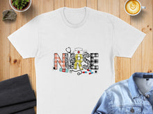 Load image into Gallery viewer, White t-shirt with "NURSE" text featuring leopard print, plaid, medical icons, and spiders.
