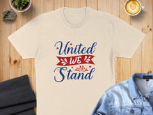 Load image into Gallery viewer, Cream t-shirt with "United We Stand" text in red and blue.
