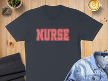 Load image into Gallery viewer, Dark gray t-shirt with "NURSE" text in coral red.
