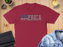 Load image into Gallery viewer, Red t-shirt with "AMERICA" in distressed flag print and stars.
