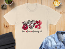 Load image into Gallery viewer, T-shirt with peace, heart, leopard print, and hearts with medicine.
