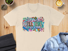 Load image into Gallery viewer, T-shirt with colorful "She Works Willingly With Her Hands" text and medical graphics.
