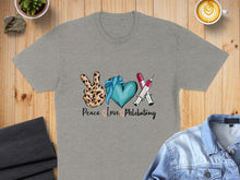 Load image into Gallery viewer, Grey t-shirt with "Peace Love Phlebotomy" text and medical icons.
