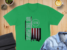 Load image into Gallery viewer, Green t-shirt with "We the People" and distressed American flag graphic.
