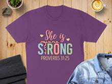 Load image into Gallery viewer, Purple t-shirt with "She is STRONG PROVERBS 31:25" text.
