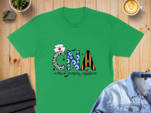 Load image into Gallery viewer, Green t-shirt with "CNA Certified Nursing Assistant" text and Halloween-themed graphics.
