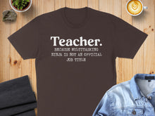 Load image into Gallery viewer, Brown t-shirt with white text reading "Teacher. Because multitasking ninja is not an official job title."
