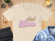 Load image into Gallery viewer, Cream t-shirt with "Blessed Nurse" text in groovy purple and pink font.
