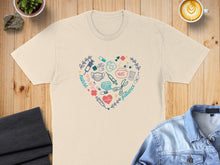 Load image into Gallery viewer, Cream t-shirt with heart-shaped nurse-themed graphic and text.
