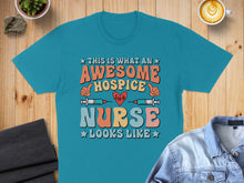 Load image into Gallery viewer, Teal t-shirt with "Awesome Hospice Nurse" graphic and heart monitor.

