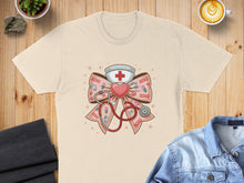 Load image into Gallery viewer, Cream t-shirt with medical-themed bow graphic and "XOXO" text.
