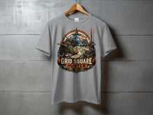 Load image into Gallery viewer, Grey t-shirt with "GRID SQUARE HUNTER" graphic featuring a hiker, radio, and compass.
