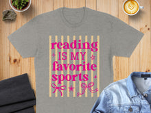 Load image into Gallery viewer, Grey t-shirt with pink text "Reading is my favorite sports" and bows.
