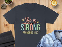 Load image into Gallery viewer, Dark t-shirt with "She is STRONG" and "PROVERBS 31:25" text.
