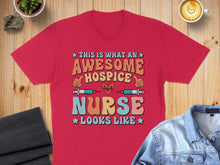 Load image into Gallery viewer, Red t-shirt with "This is what an awesome hospice nurse looks like" text.
