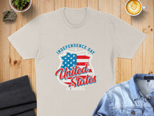 Load image into Gallery viewer, Cream t-shirt with "Independence Day United States of America" shield logo.
