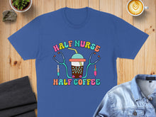 Load image into Gallery viewer, Blue t-shirt with "Half Nurse Half Coffee" text and stethoscope-adorned coffee cup.
