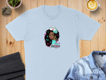 Load image into Gallery viewer, Light blue t-shirt with a graphic of a nurse with dark curly hair and flowers.
