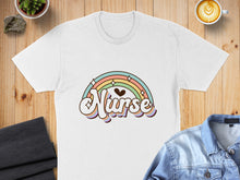 Load image into Gallery viewer, White t-shirt with rainbow and "Nurse" text graphic.

