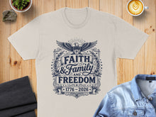 Load image into Gallery viewer, Beige t-shirt with "Faith &amp; Family and Freedom 1776-2026" text and eagle design.
