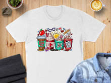 Load image into Gallery viewer, T-shirt with cartoon medical and coffee items, "School Nurse Fuel" text.
