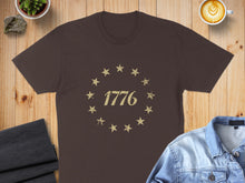Load image into Gallery viewer, Brown t-shirt with distressed 1776 text within a star circle.
