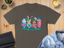 Load image into Gallery viewer, Brown t-shirt with "Emergency Nurse" text and four cartoon coffees.
