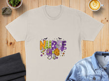 Load image into Gallery viewer, Cream t-shirt with "Nurse" Halloween graphic, featuring pumpkins, bats, and medical symbols.
