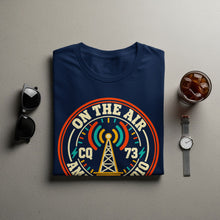 Load image into Gallery viewer, Dark blue t-shirt with "On The Air CQ 73 Amateur Radio" design featuring a radio tower.
