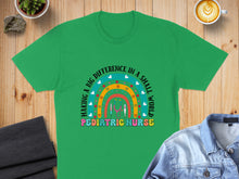 Load image into Gallery viewer, Green t-shirt with "Making a Big Difference in a Small World Pediatric Nurse" text.
