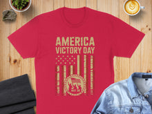Load image into Gallery viewer, Red t-shirt with "America Victory Day" and flag graphic.
