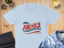 Load image into Gallery viewer, Light blue t-shirt with "AMERICA" in red and blue patriotic lettering.
