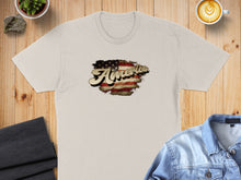 Load image into Gallery viewer, Cream t-shirt with distressed American flag graphic and "America" text.
