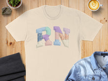 Load image into Gallery viewer, Cream t-shirt with "RN" appliqué in patchwork fabric letters.
