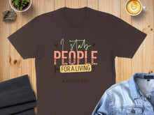 Load image into Gallery viewer, Brown t-shirt with "I stab people for a living" and #nurselife.

