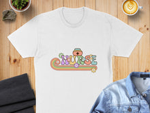 Load image into Gallery viewer, White t-shirt with "NURSE" in retro rainbow font with floral accents.
