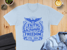 Load image into Gallery viewer, Light blue t-shirt with "Faith &amp; Family and Freedom" in blue stars and eagle design.
