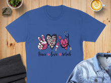 Load image into Gallery viewer, Blue t-shirt with "Peace Love Scrub" graphic featuring hearts and stethoscope.
