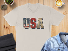 Load image into Gallery viewer, Beige t-shirt with "USA" text in distressed American flag and skyscraper design.
