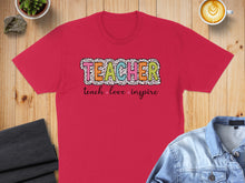 Load image into Gallery viewer, Red t-shirt with "TEACHER" in colorful block letters and "teach love inspire" below.
