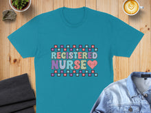 Load image into Gallery viewer, Turquoise t-shirt with "REGISTERED NURSE" in colorful squares and a heart.
