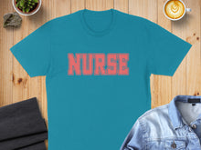 Load image into Gallery viewer, Teal t-shirt with "NURSE" text in coral lettering.
