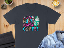 Load image into Gallery viewer, Dark t-shirt with "This Nurse Needs Coffee" text and latte art.
