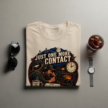 Load image into Gallery viewer, Cream t-shirt with graphic of man with headphones talking on radio, text "JUST ONE MORE CONTACT".
