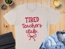 Load image into Gallery viewer, Light pink t-shirt with "Tired Teachers Club" and a pink bow.
