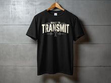Load image into Gallery viewer, Black t-shirt with "BUILT TO TRANSMIT" and radio tower graphic.
