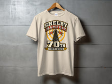 Load image into Gallery viewer, Cream t-shirt with Shelby Hamfest 70th 1957-2026 graphic.
